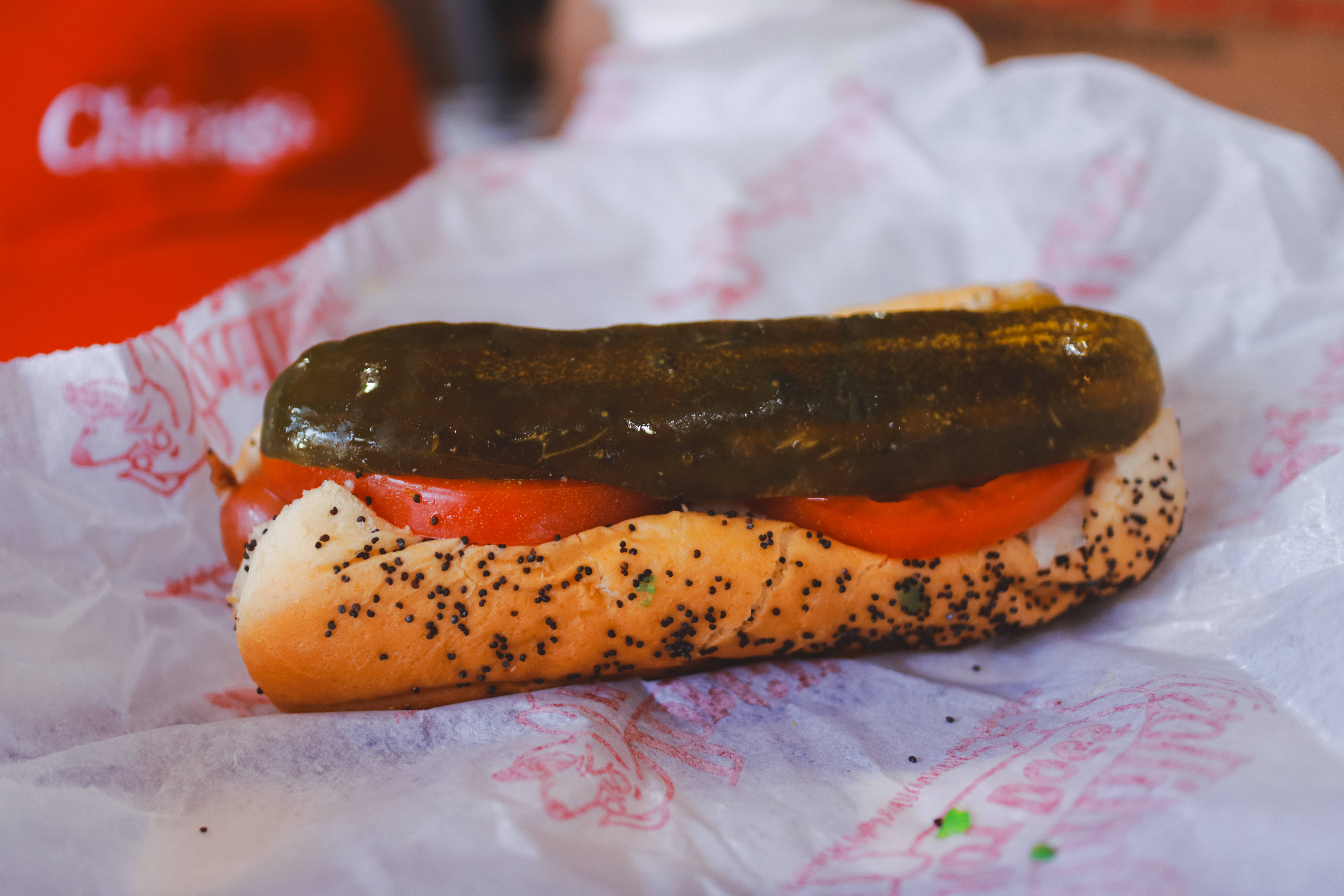 Chicago-style hot dog at Portillo's — sport pepper, dill pickle spear, celery salt, poppy seed bun