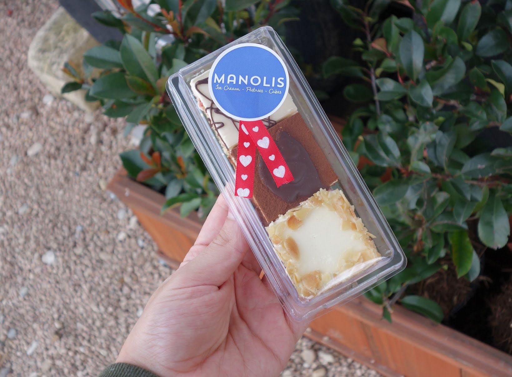 Manolis sticker on pastry box